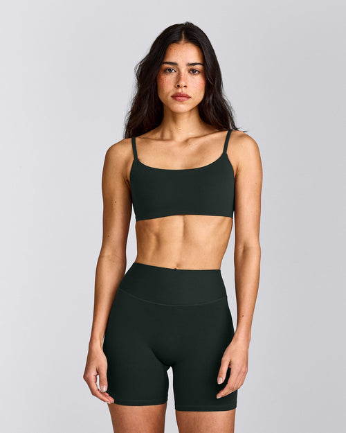 SoftMotion™ Strappy Sports Bra with Gray Logo | Emerald Noir