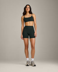 SoftMotion™ Strappy Sports Bra with Grey Logo | Emerald Noir