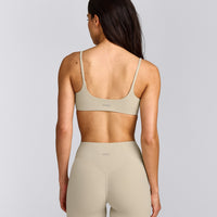 SoftMotion™ Strappy Sports Bra with Gray Logo | Oatmeal