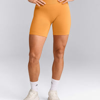 EffortlessLift™ Seamless Mid Rise Shorts with Grey Logo | Powdered Orange