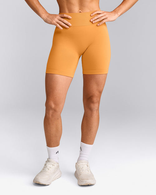 EffortlessLift™ Seamless Mid Rise Shorts with Gray Logo | Powdered Orange
