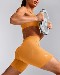 EffortlessLift™ Seamless Mid Rise Shorts with Grey Logo | Powdered Orange