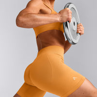 EffortlessLift™ Seamless Mid Rise Shorts with Grey Logo | Powdered Orange