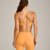 UnifiedMove™ Cross Back Sports Bra with Reflective Logo | Powdered Orange