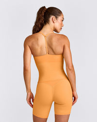 UnifiedMove™ T Back Mid Vest with Built in Bra Shelf with Reflective Logo | Powdered Orange