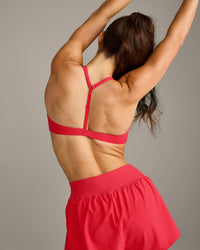 UnifiedMove™ T Back Minimal Bralette with Reflective Logo | Charged Pink