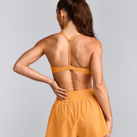 UnifiedMove™ T Back Minimal Bralette with Reflective Logo | Powdered Orange