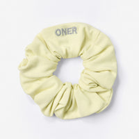 SoftMotion™ Scrunchie with Grey Logo | Pastel Yellow