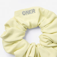SoftMotion™ Scrunchie with Grey Logo | Pastel Yellow