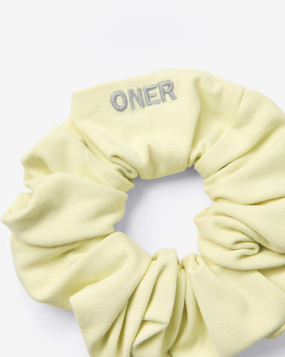 SoftMotion™ Scrunchie with Grey Logo | Pastel Yellow