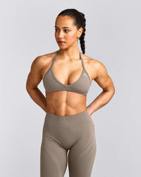 EnhanceLift™ Seamless Minimal Halter Neck Bralette with Grey Logo | Warm Minky