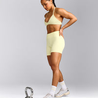 EnhanceLift™ Seamless Minimal Halter Neck Bralette with Grey Logo | Pastel Yellow