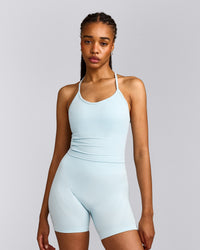 EnhanceLift™ Seamless Strappy Racer Vest with Built in Bra Shelf with Grey Logo | Cloud Blue