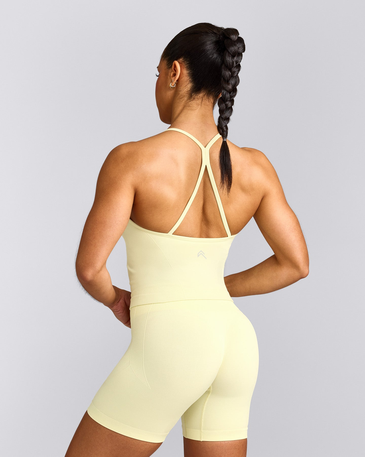 EnhanceLift™ Seamless Strappy Racer Vest with Built in Bra Shelf with Grey Logo | Pastel Yellow
