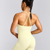 EnhanceLift™ Seamless Strappy Racer Vest with Built in Bra Shelf with Grey Logo | Pastel Yellow