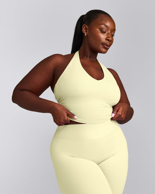 SoftMotion™ Halter Neck Mid Vest with Built in Bra Shelf with Grey Logo | Pastel Yellow