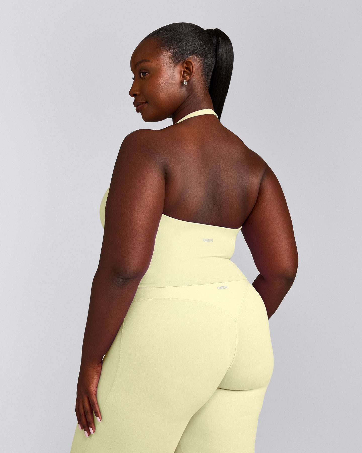 SoftMotion™ Halter Neck Mid Vest with Built in Bra Shelf with Grey Logo | Pastel Yellow