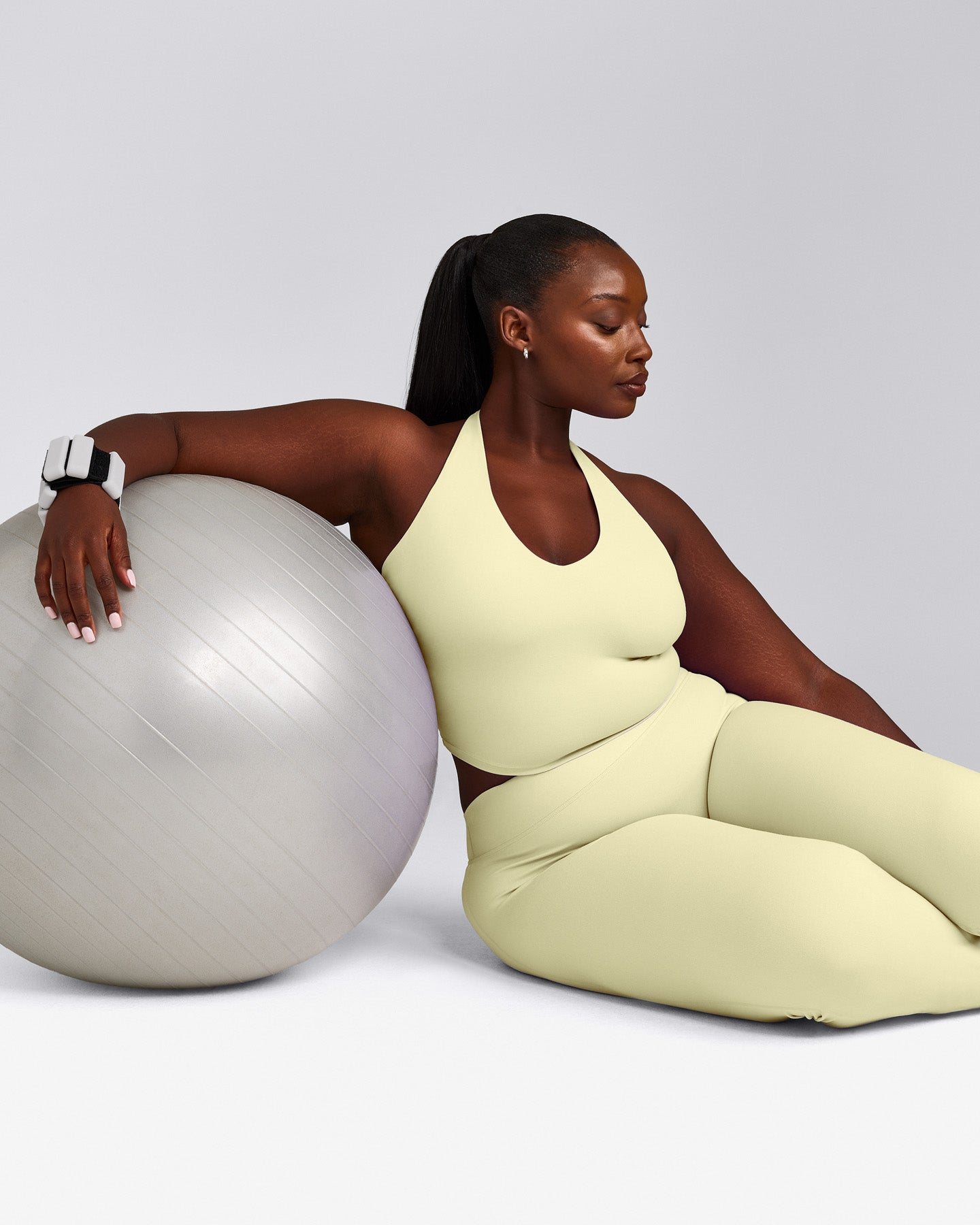 SoftMotion™ Halter Neck Mid Vest with Built in Bra Shelf with Grey Logo | Pastel Yellow