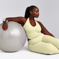 SoftMotion™ Halter Neck Mid Vest with Built in Bra Shelf with Grey Logo | Pastel Yellow