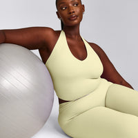 SoftMotion™ Halter Neck Mid Vest with Built in Bra Shelf with Grey Logo | Pastel Yellow