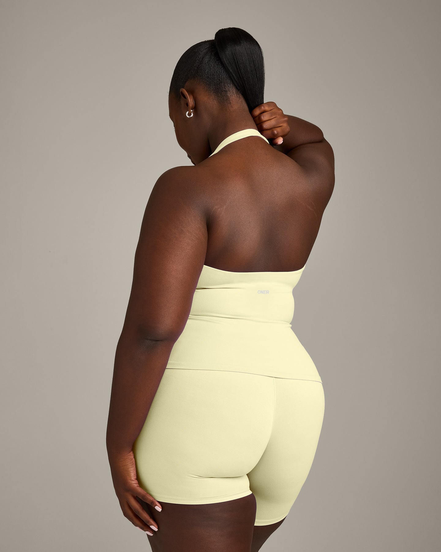 SoftMotion™ Halter Neck Vest with Built in Bra Shelf with Grey Logo | Pastel Yellow
