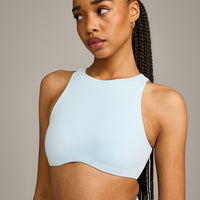 SoftMotion™ High Neck Sports Bra with Grey Logo |  Cloud Blue