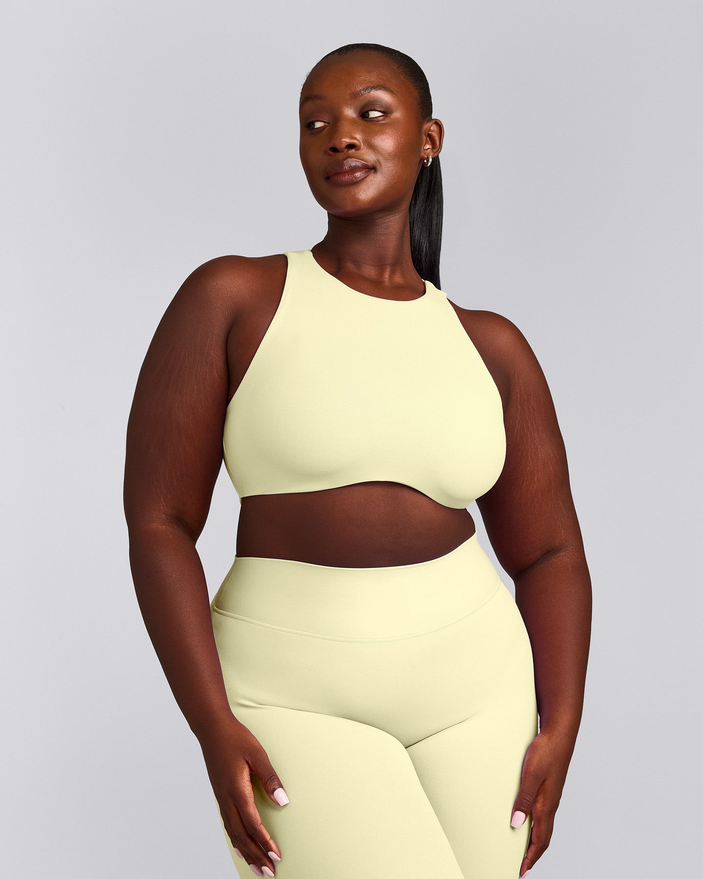 SoftMotion™ High Neck Sports Bra with Grey Logo | Pastel Yellow