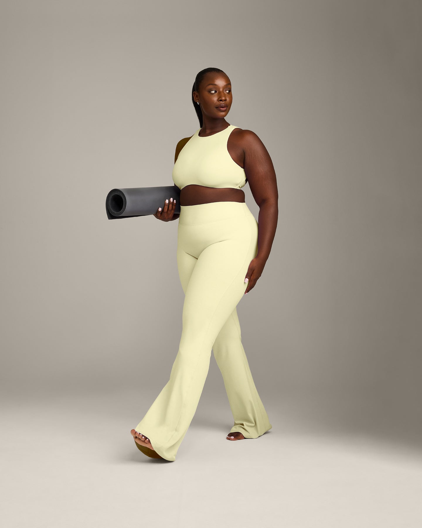SoftMotion™ High Neck Sports Bra with Grey Logo | Pastel Yellow