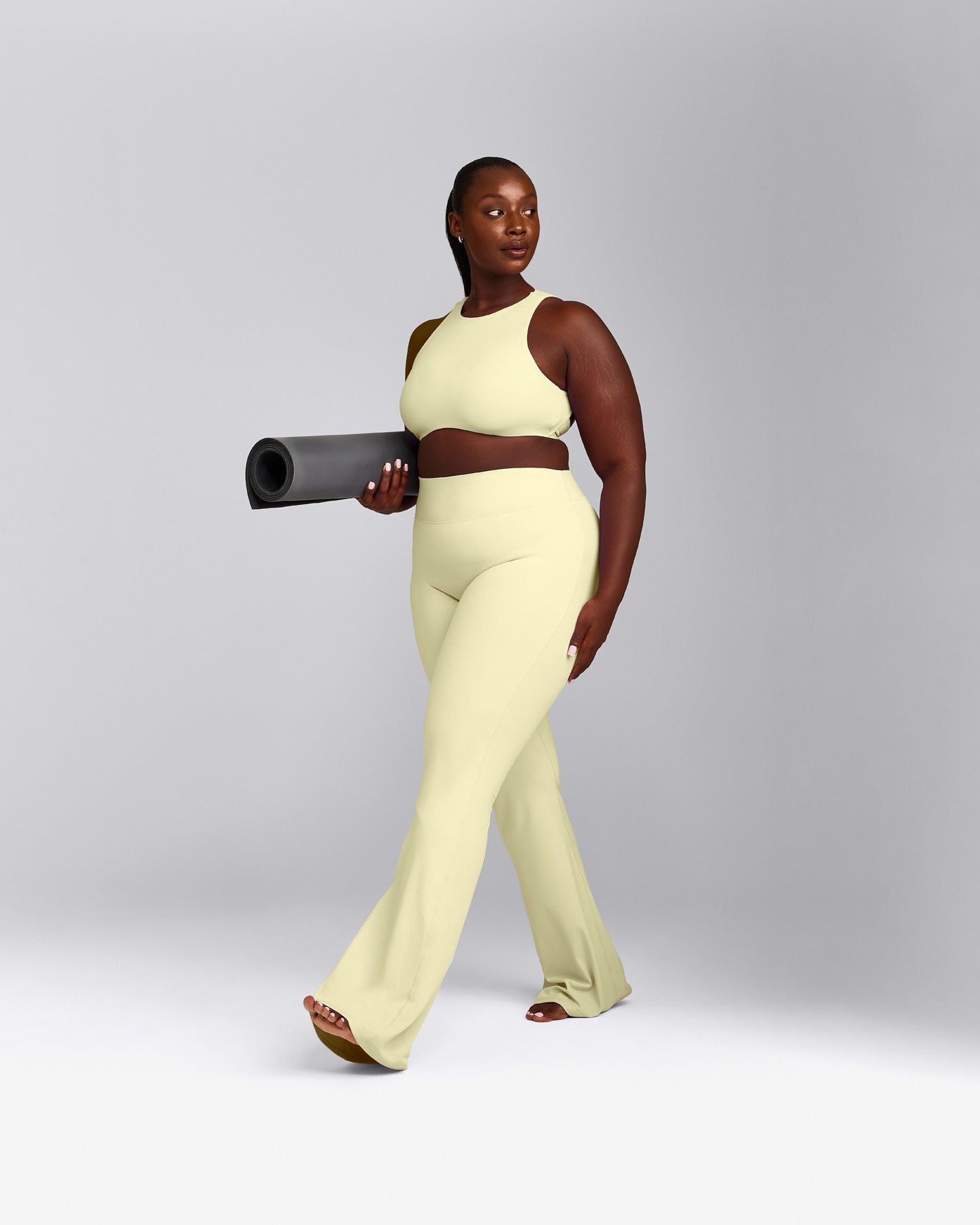 SoftMotion™ High Neck Sports Bra with Grey Logo | Pastel Yellow