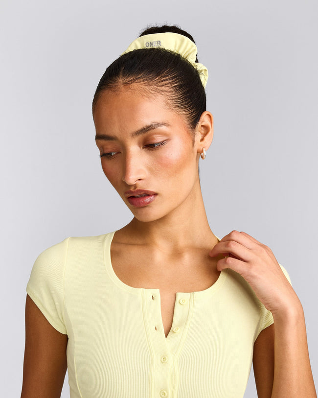 SoftMotion™ Scrunchie with Grey Logo | Pastel Yellow