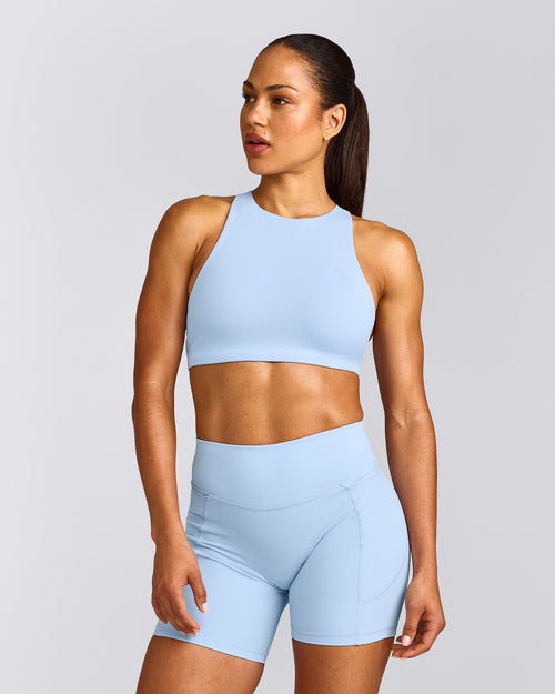EasyLift™ High Neck Sports Bra with Gray Logo | Powdered Blue