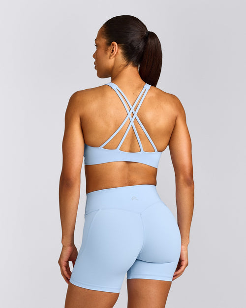 EasyLift™ High Neck Sports Bra with Gray Logo | Powdered Blue
