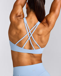 EasyLift™ High Neck Sports Bra with Gray Logo | Powdered Blue