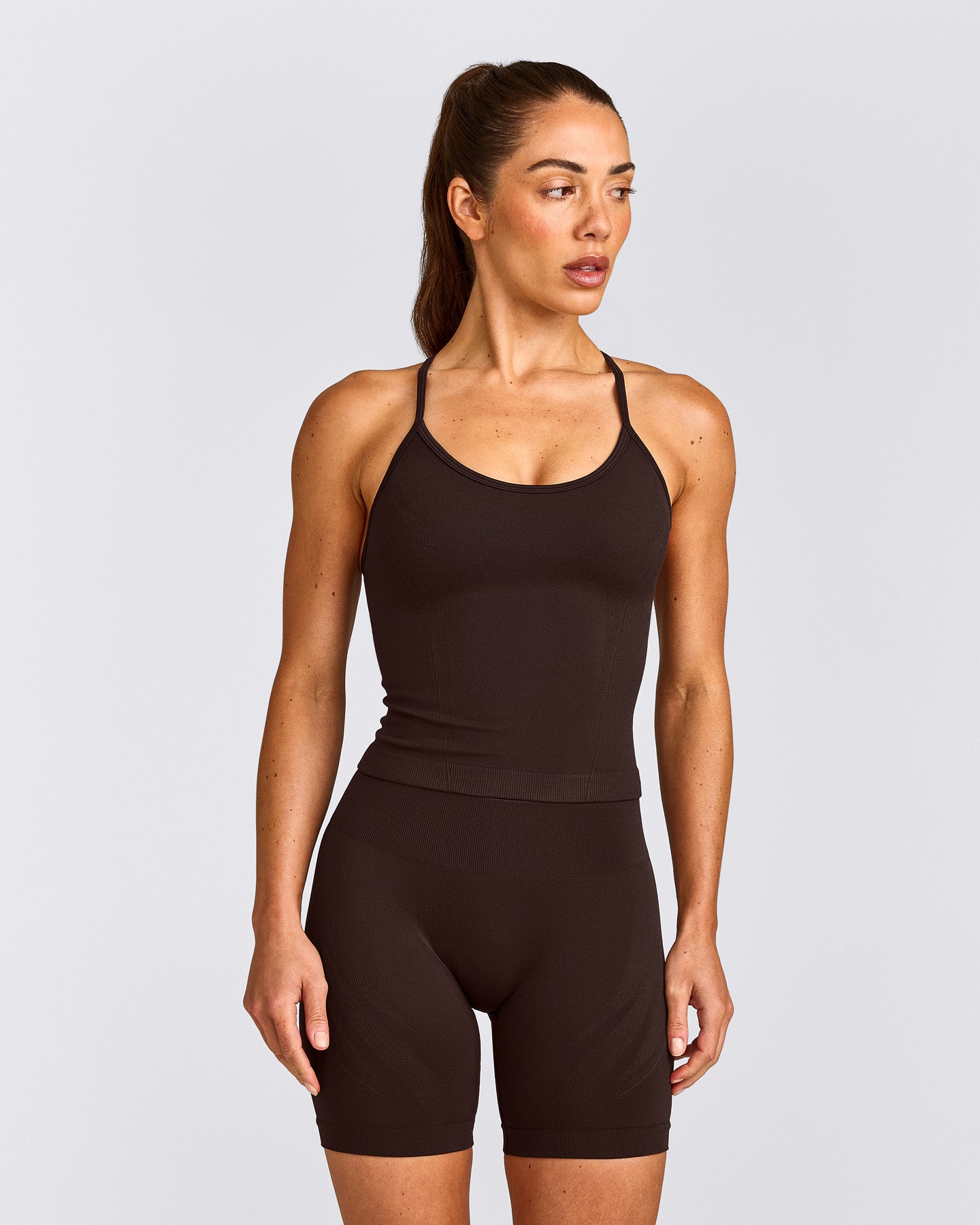 EnhanceLift™ Seamless Strappy Racer Tank Top with Built in Bra Shelf with Gray Logo | 70% Cocoa