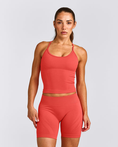 EnhanceLift™ Seamless Strappy Racer Tank Top with Built in Bra Shelf with Gray Logo | Dark Charged Coral