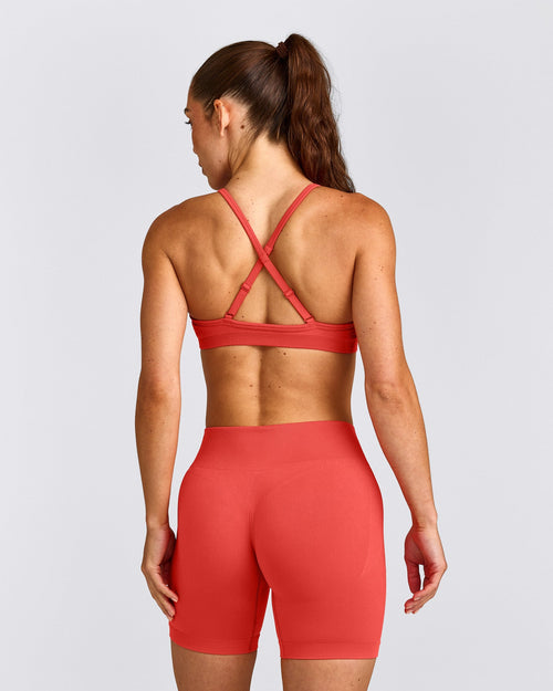 EnhanceLift™ Seamless Strappy Sports Bra with Gray Logo | Dark Charged Coral