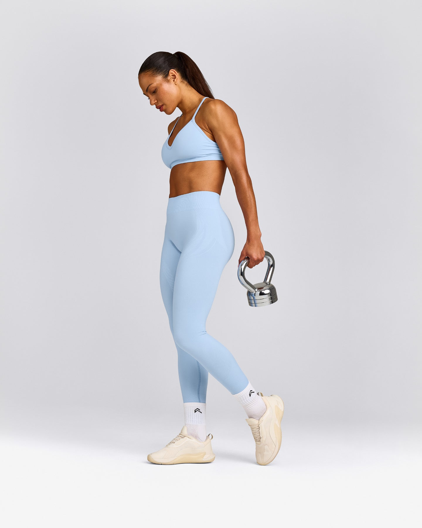 EnhanceLift™ Seamless Strappy Sports Bra with Gray Logo | Powdered Blue