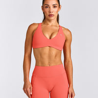 UnifiedMove™ Cross Back Sports Bra with Reflective Logo | Light Charged Coral