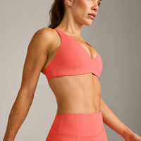 UnifiedMove™ Cross Back Sports Bra with Reflective Logo | Light Charged Coral