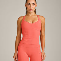 UnifiedMove™ T Back Mid Vest with Built in Bra Shelf with Reflective Logo | Light Charged Coral