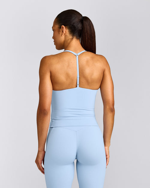 UnifiedMove™ T Back Mid Tank Top with Built in Bra Shelf with Reflective Logo | Powdered Blue