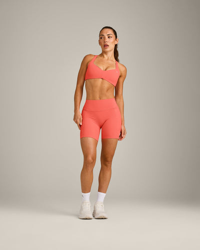 UnifiedMove™ T Back Minimal Bralette with Reflective Logo | Light Charged Coral