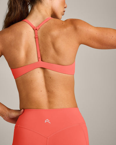 UnifiedMove™ T Back Minimal Bralette with Reflective Logo | Light Charged Coral