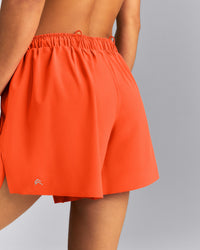 AirMove™ Lined Pocket Shorts 4" | Energy Orange