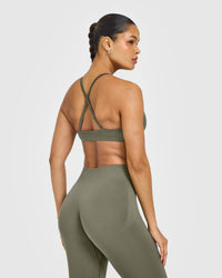 EnhanceLift™ Seamless Strappy Sports Bra with White Logo | Alpine Green