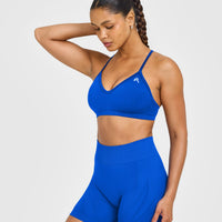 EnhanceLift™ Seamless Strappy Sports Bra with White Logo | Cobalt Blue