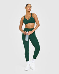 EnhanceLift™ Seamless Strappy Sports Bra with White Logo | Racing Green