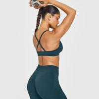 EnhanceLift™ Seamless Strappy Sports Bra with White Logo | Washed Oil Blue