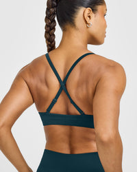 EnhanceLift™ Seamless Strappy Sports Bra with White Logo | Washed Oil Blue