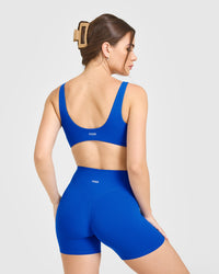 SoftMotion™ Scoop Back Bralette with White Logo | Light Cobalt Blue